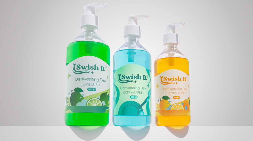 Three bottles of 'Swish It' dishwashing liquid with different scents on a white background